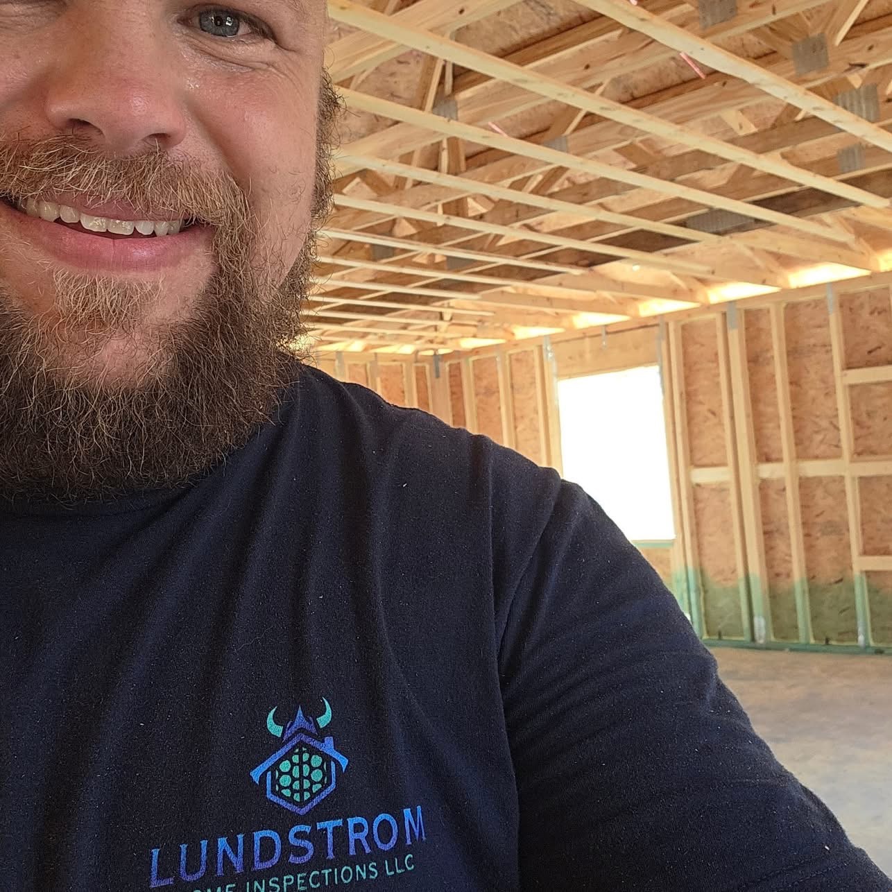 Scott Lundstrom, owner of Lundstrom Home Inspections LLC, smiling on a Charlotte County Habitat for Humanity build site