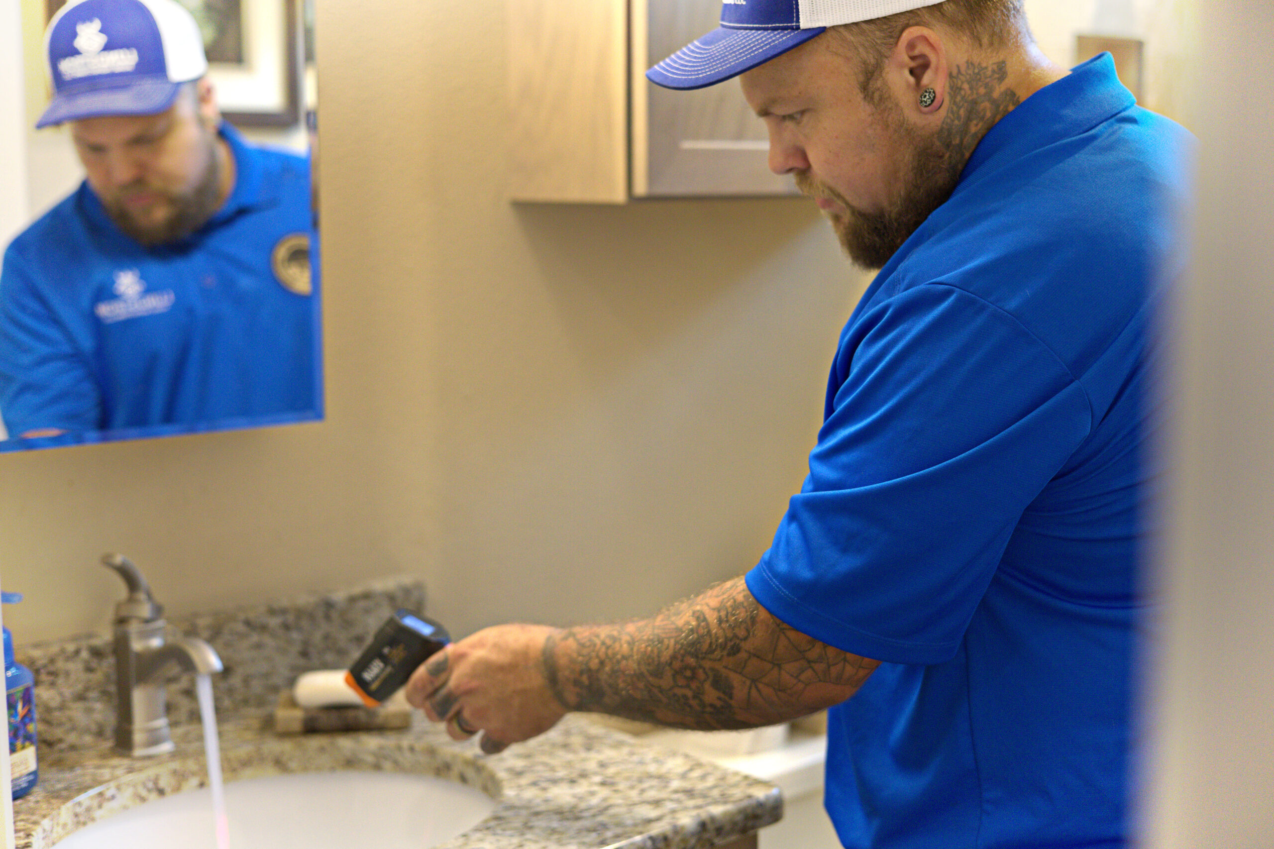 Water quality inspection by a certified Lundstrom Home Inspections professional testing residential water at an indoor sink.