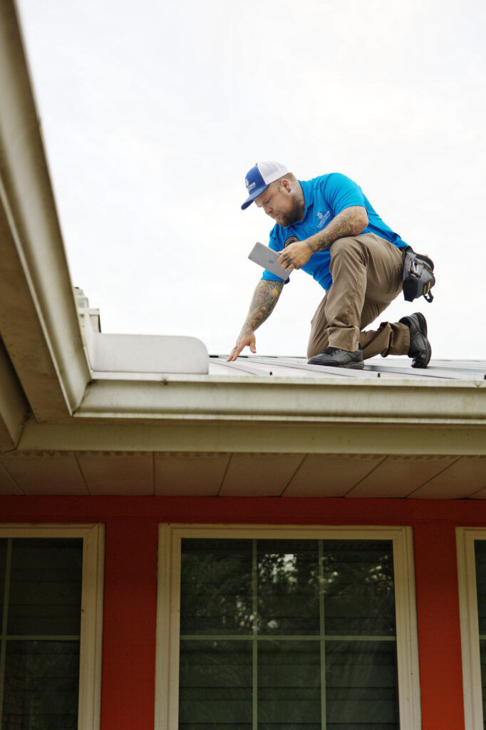 Professional roof inspection in North Port, FL, performed by Scott Lundstrom, documenting residential roof condition on a digital tablet.