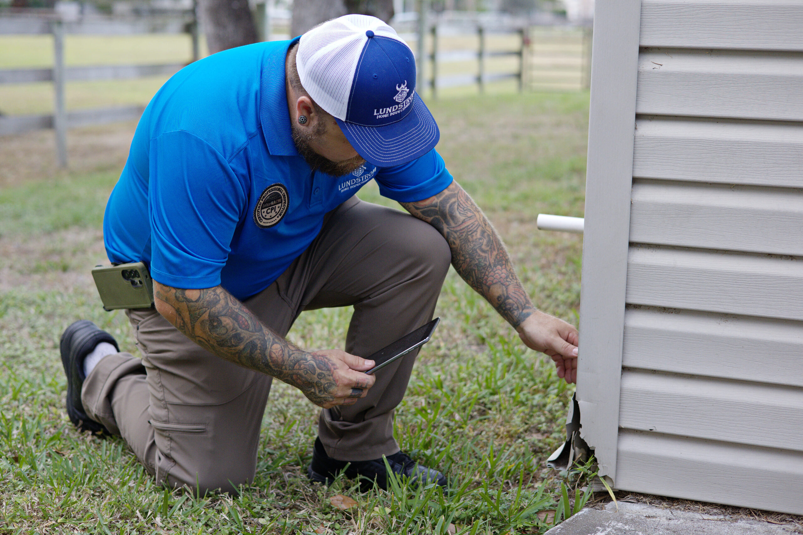 11-month warranty inspection by Lundstrom Home Inspections documenting exterior siding damage before builder warranty expiration