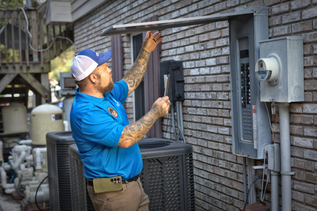4-point inspection by Lundstrom Home Inspections examining exterior electrical panel and service equipment